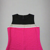 Black and pink sleeveless dress on a tiled floor